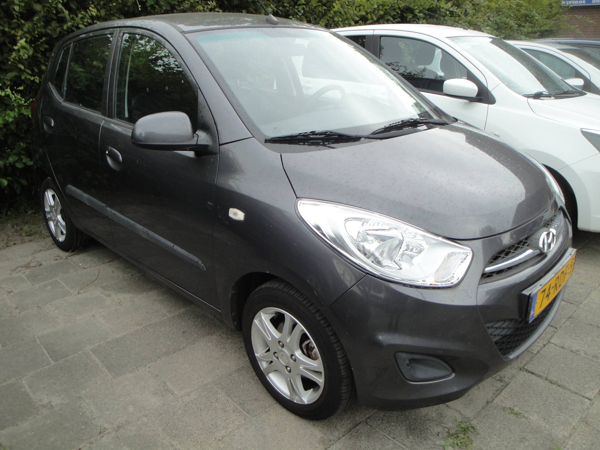 Hyundai i10 1.1 i-Drive 5-Drs. Cool  met o.a. Airco, Audio, LM-velgen, etc. - Thumbnail 1